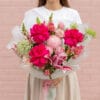 Fuchsia Fantasy Bouquet 2 Spoil them with our Fuchsia Fantasy Bouquet this Valentine's Day! A stunning mix of hot pink roses, lilies, and more. Order now for a wow-worthy delivery!